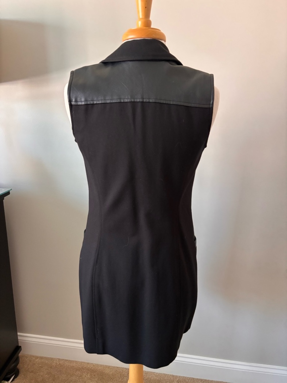 Sleek Black Sleeveless Vest with Faux Leather Yoke and pockets!
